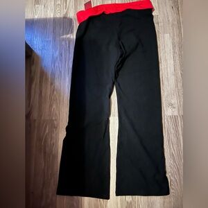 NWT Victoria’s Secret yoga pants. Size extra large, black with red band.